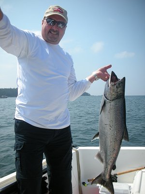 Mansel from Calgary Alberta was thrilled with this 23 pound Chinook Salmon he landed using anchovy on the surf line of Barkley Sound located on beautiful Vancouver Island.  This salmon hit an anchovy in a Rhys Davis Teaser Head.  Guide was John of Slivers Charters Salmon Sport Fishing.  Fishing in Barkley Sound for Chinook and Coho during the 2014 season will be spectacular.  Dont miss out