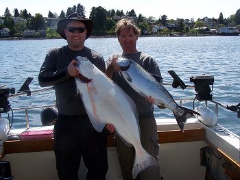 Ed and Graham with halibut and Chinook    two fish displayed at the Ucluelet Harbor located on the west coast of Vancouver Island.  Guide was Doug of Slivers Charters Salmon Sport Fishing in July of 2012.  Fishing in summer of 2013 in Tofino-Ucluelet should be similar